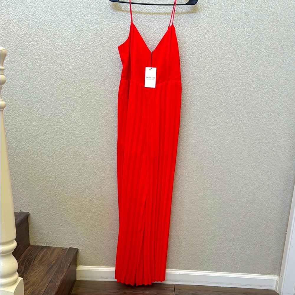 Elegant Red Maxi jumpsuit
New with tags